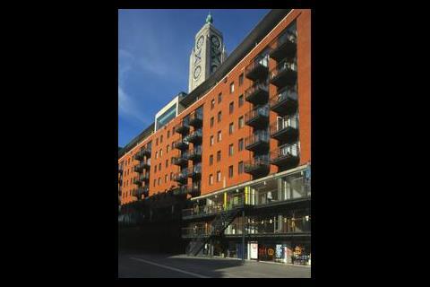 London’s Oxo Tower features apartments beneath a rooftop restaurant but above street level shops and offices